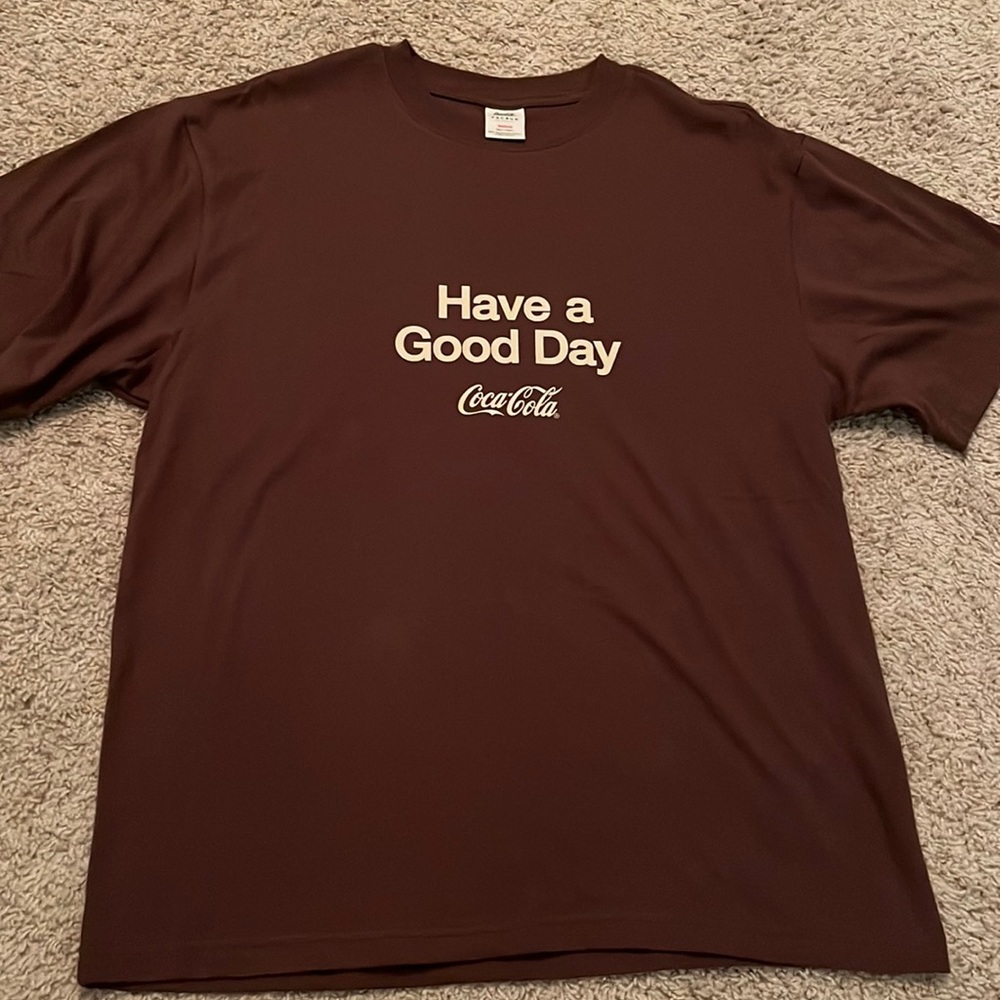 brown coca cola shirt